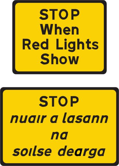 The driver must stop when red lights show.
