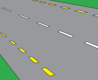 The edge of the carriageway or hard shoulder.